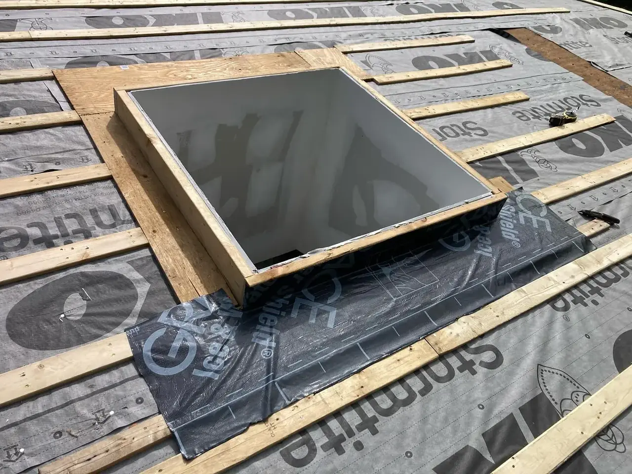 Skylight installation during a roofing project
